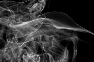 Close-up of smoke against black background