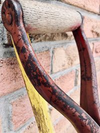 Close-up of rusty pipe against wall