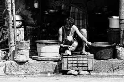 Man working at statue