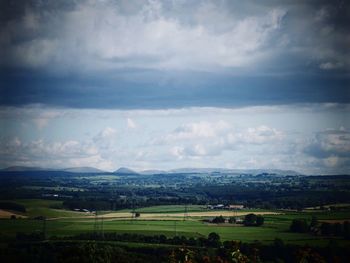 Scenic view of landscape against cloudy sky