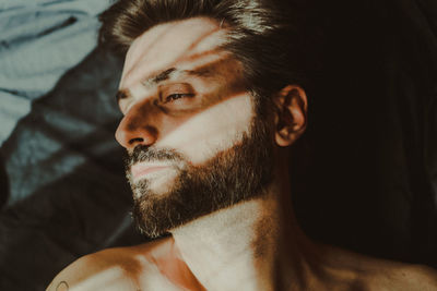 Sunlight falling on young man