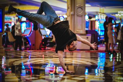 Full length of man dancing on floor