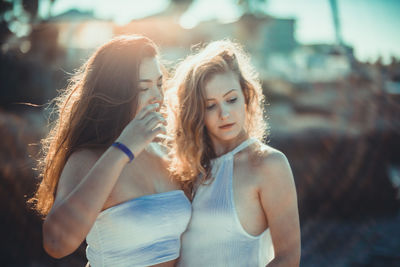 Beautiful young women standing outdoors