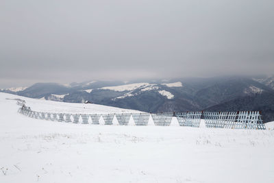 Scenic view of mountains against sky during winter