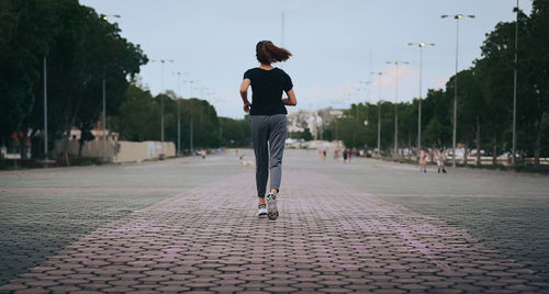 Back view point of young women running in the evening , healthy , inspiration and motivation concept