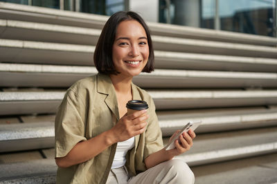 Young woman using mobile phone