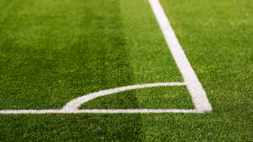 Shadow of woman on soccer field