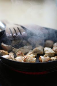 Close-up of meat in cooking pan