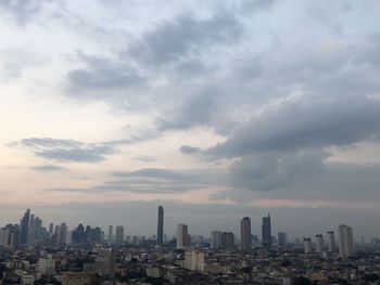 Cityscape against sky during sunset