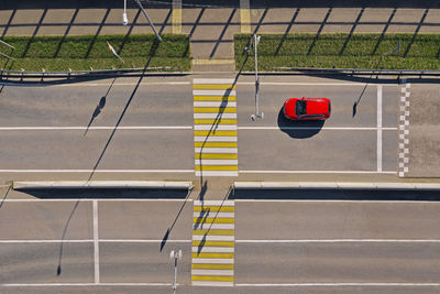 Russia, aerial view of single car in front of empty zebra crossing