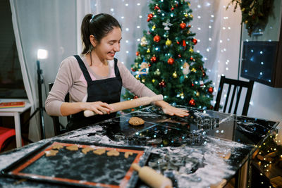 Portrait of young woman working at home