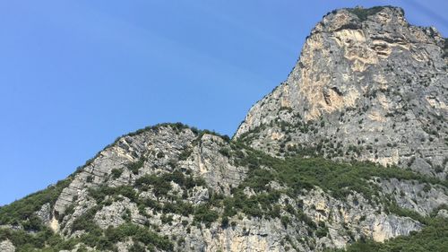 Low angle view of rock formation against sky