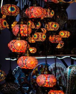 Close-up of illuminated christmas decorations at market stall