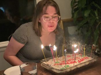 Portrait of mid adult man with drink on table