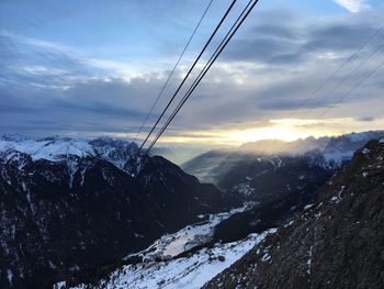 Scenic view of snowcapped mountains against sky during winter