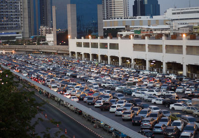 High angle view of cars on street against buildings in city