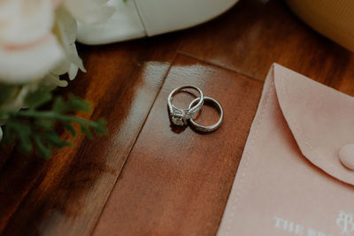 High angle view of wedding rings on table