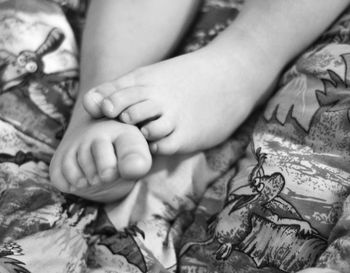 Cropped image of child's feet