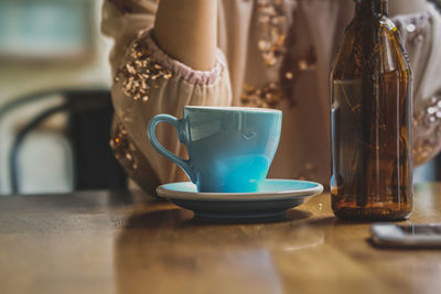 Close-up of coffee cup on table