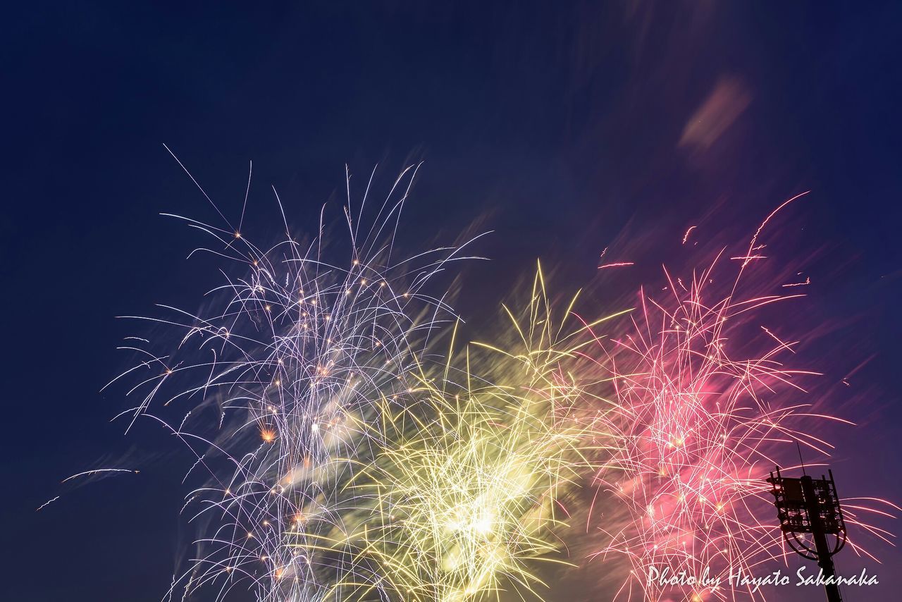 night, illuminated, firework display, arts culture and entertainment, long exposure, celebration, exploding, motion, firework - man made object, sparks, event, low angle view, blurred motion, sky, glowing, firework, entertainment, multi colored, celebration event, outdoors