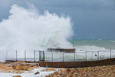 Smoke emitting from chimney against sky