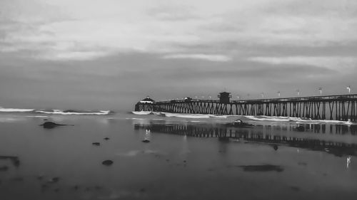 Scenic view of sea against sky in city