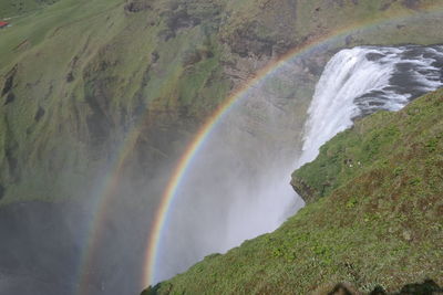 Scenic view of rainbow over water