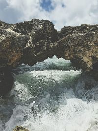 Scenic view of sea against cloudy sky