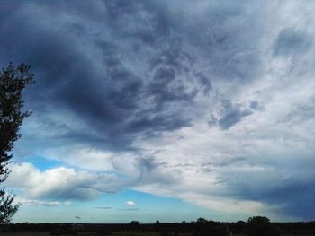 Low angle view of cloudy sky over landscape