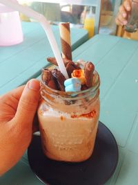 Close-up of hand holding ice cream