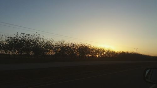 View of road against sky during sunset