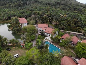 High angle view of swimming pool by buildings in city