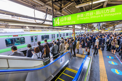 Group of people at railroad station platform