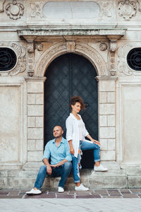 Full length portrait of a smiling young couple