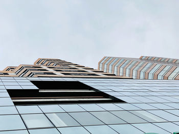 Low angle view of modern building against sky