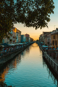 View of buildings in city at sunset