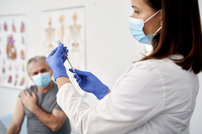 Side view of woman with syringe