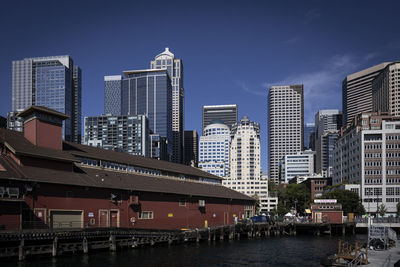 Modern buildings in city against sky