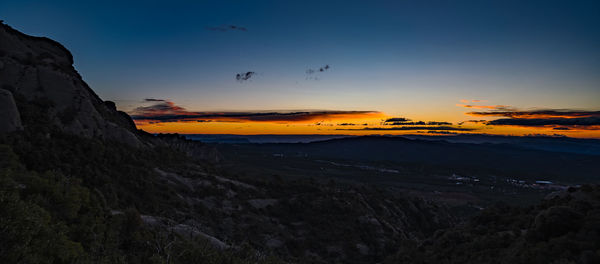 Scenic view of landscape against sky during sunset