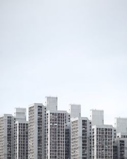 Modern cityscape against clear sky