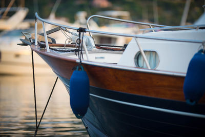Close-up of sailboat moored in sea