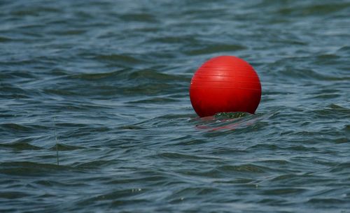 Red ball bouy in reservoir