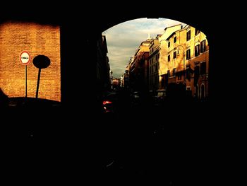 Buildings in city at sunset