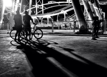 Man riding bicycle at night