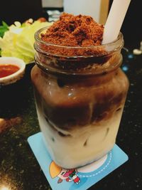 Close-up of drink in jar on table