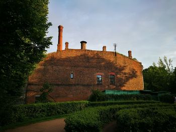 Low angle view of old building against sky