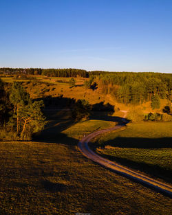 Scenic view of landscape against clear blue sky