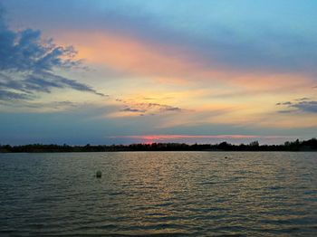 Scenic view of sea against sky at sunset