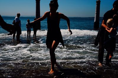 Woman standing on beach