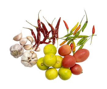 Close-up of berries against white background